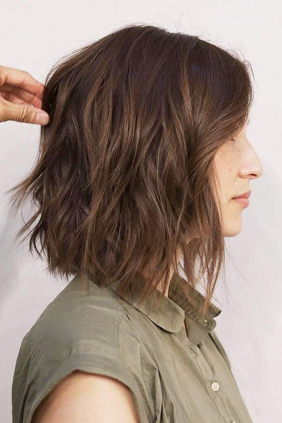 Profile view of woman with layered bob