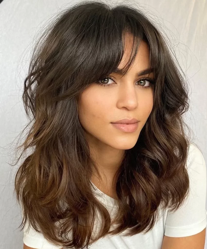 Brunette with thick side swept bangs