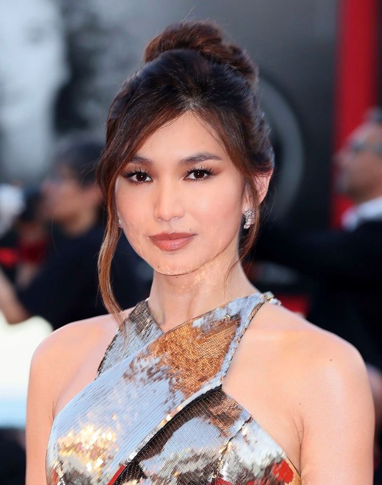 Gemma Chan with hair in bun and sweeping bangs